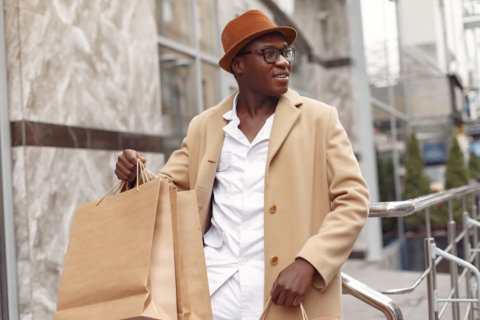 A shopper heading home with the bags from something he saved for